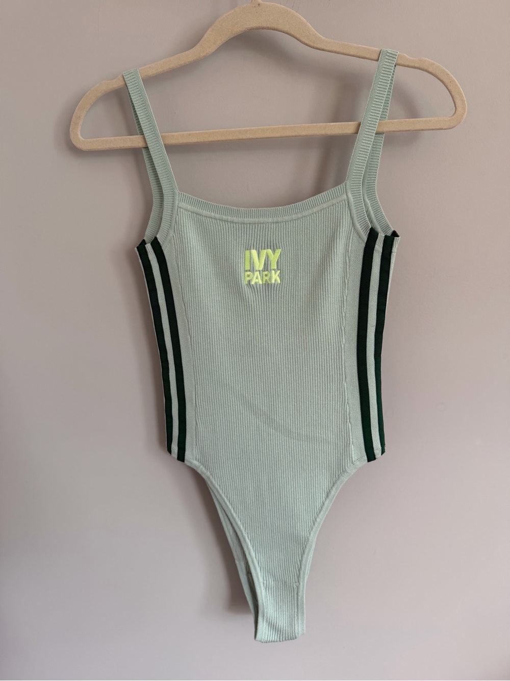 Ivy Park adidas light sage ribbed bodysuit with dark green stripes